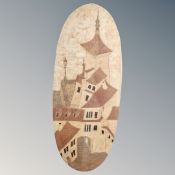 A fabric upholstered oval wall panel depicting houses