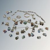 A 9ct gold earring, further baby brooch, silver charm bracelet with enamelled fobs,