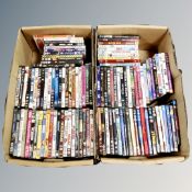 Two boxes containing approximately 100 DVD's