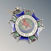 A silver and enamel medal for the Caledonian society of Johannesburg