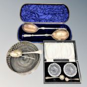 A silver plated wine coaster, pair of cut glass salts, cased pair of plated spoons,