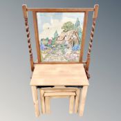 A nest of three pine effect tables together with an oak barleytwist firescreen
