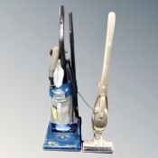 An Electrolux cyclone vacuum together with Morphy Richards stick vacuum with stand