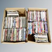 Two boxes containing approximately 100 DVD's