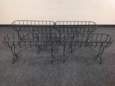 Five wire metal plant troughs on folding legs