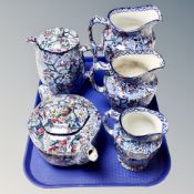 A tray of three Maling Ringtons chintz graduated jugs,