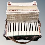 A Hohner Verdi II piano accordian in case