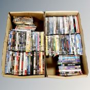 Two boxes containing approximately 100 DVD's