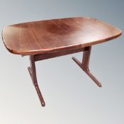 A 20th century Mobel furniture extending dining table together with a set of five rail back chairs