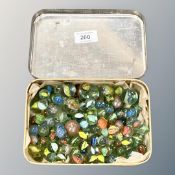 An old tin of marbles (Q)