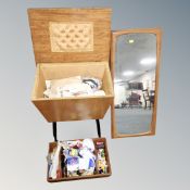 A mid century sewing box with contents together with a 1970's teak framed mirror