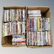 Two boxes containing approximately 100 dvds