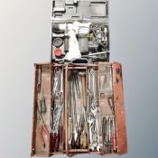 A metal Roebuck concertina tool box containing hand tools, spanners,