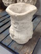 A concrete Toby Jug planter
