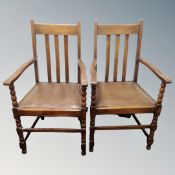 A pair of Edwardian oak carver armchairs