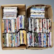Two boxes containing approximately 100 dvds