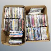 Two boxes containing approximately 100 dvds
