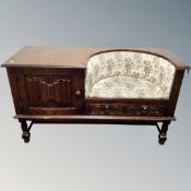 An oak linen fold telephone seat