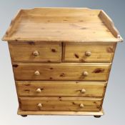 A pine five drawer chest