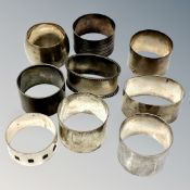 Nine heavy gauge silver serviette rings, 307g.
