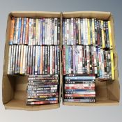 Two boxes containing approximately 100 dvds