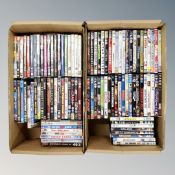 Two boxes containing approximately 100 dvds