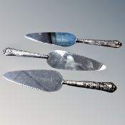 Three silver handled cake slices