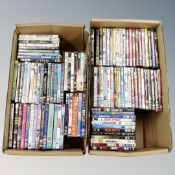 Two boxes containing approximately 100 dvds