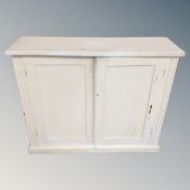 A painted oak double door cabinet