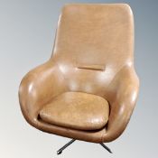 A 20th century armchair on chrome swivel base in tan vinyl