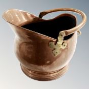 A copper and brass coal bucket