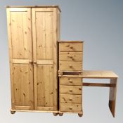 A contemporary pine double door wardrobe,