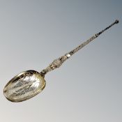 A large silver gilt copy of an anointing spoon by Elkington,