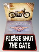Two Harley Davidson signs and a 