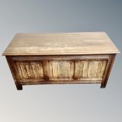 An oak linen fold blanket box, width106 cm, depth 45 cm, heigth 52 cm.