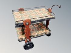 A mid century wrought iron two tier dinner wagon