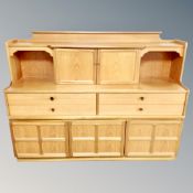 A 20th century Parker Knoll six piece dining room suite comprising of sideboard,