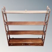 A Victorian style fretwork wall shelf fitted with two drawers