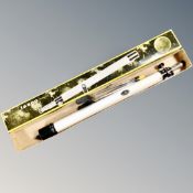 A vintage Tasco refrector telescope in box