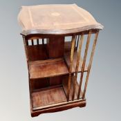 A Victorian satinwood inlaid revolving bookcase