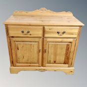 A Jaycee pine double door sideboard