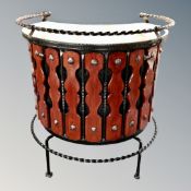 A 20th century wrought iron horse shoe shaped tiled cocktail bar and two stools