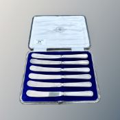 A cased set of six silver-handled butter knives
