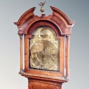 A Victorian oak longcase clock with brass dial, pendulum and weights, the dial marked 'Hutchinson,