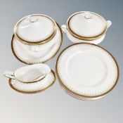 Thirteen pieces of Paragon Athena bone china dinner ware, six dinner plates, two lidded tureens,