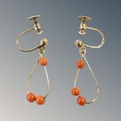 A pair of 9ct gold coral earrings with screw backs. CONDITION REPORT: 1.