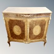 A Versailles Period High Fidelity double door serpentine fronted cabinet with gilt metal mounts