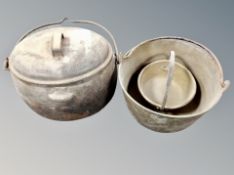 An antique cast iron oval lidded pan with handle together with two antique brass cast iron jam pans