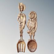 A vintage carved Don Quixote oversized wooden fork and spoon