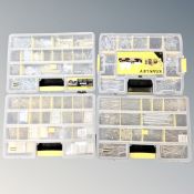 Four Stanley compartmental organisers containing screws and hardware